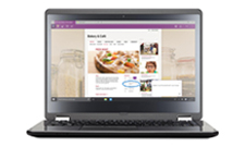 A Windows laptop with OneNote opened, with various snapped photos and ideas written by touch or stylus.